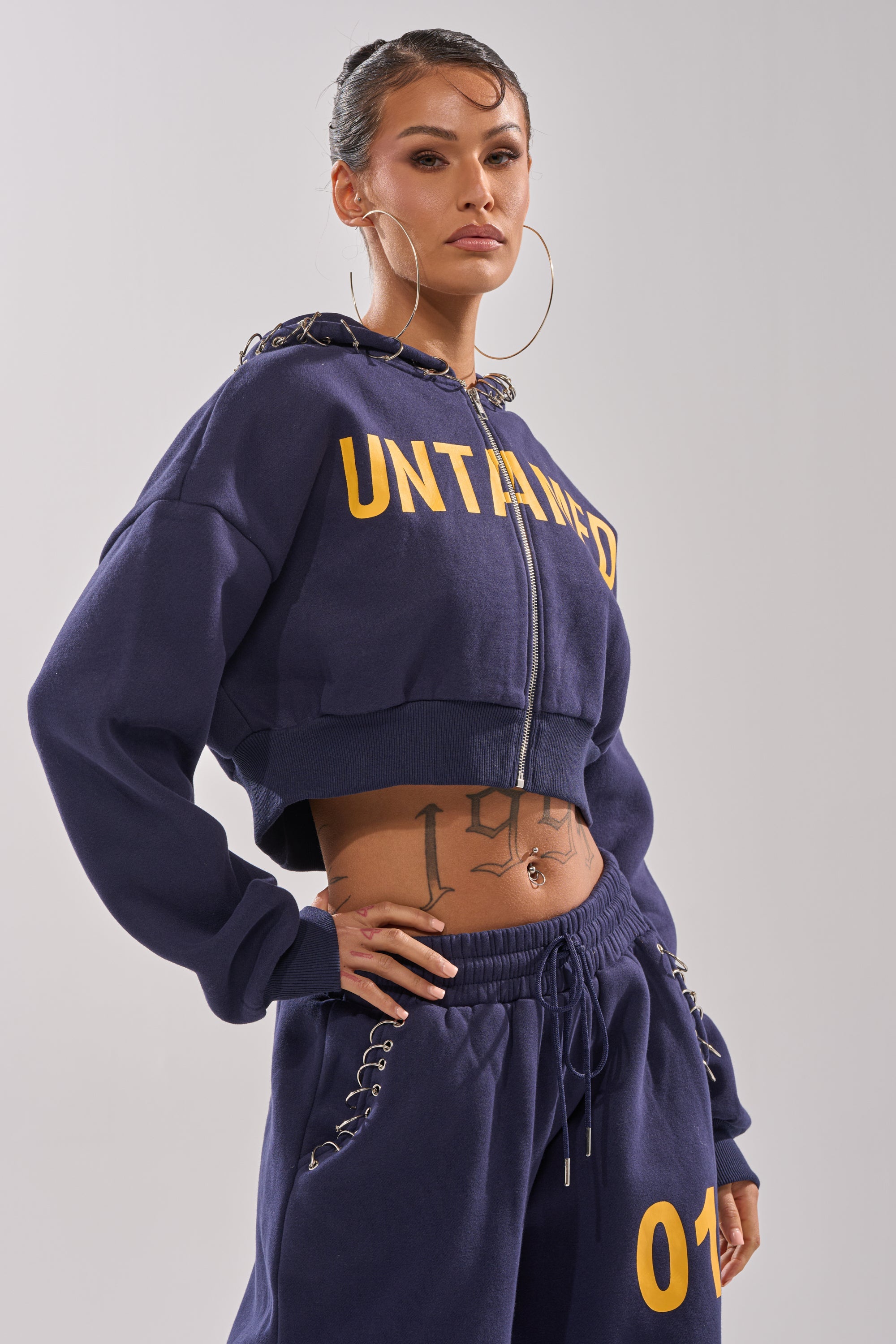 UNTAMED METAL RING SWEATSHIRT