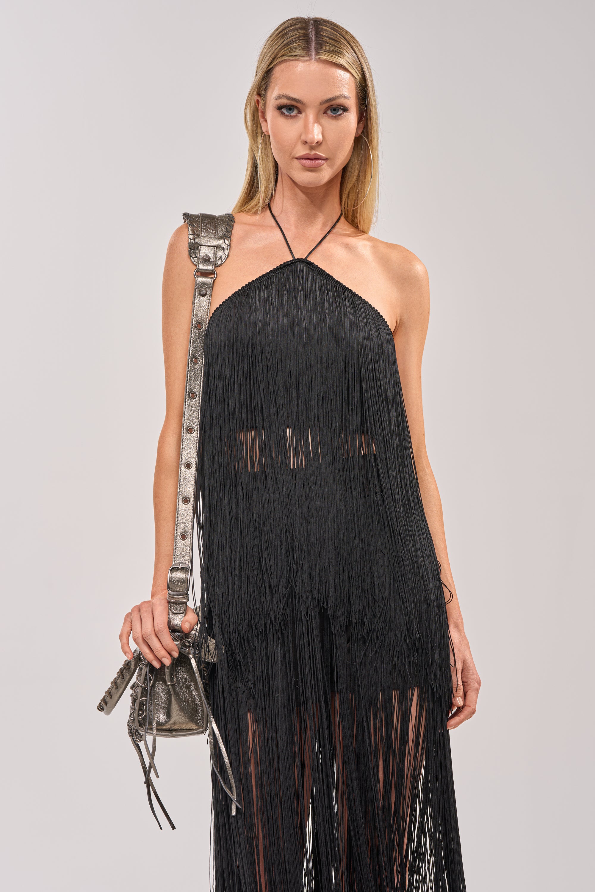 ON THE EDGE FRINGE HALTER TOP IN BLACK